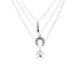 The Good Luck Charms Pendant Stacked Necklace, measuring 17 inches and silver plated, features a beautiful layered design with charms including a horseshoe, a small Eiffel Tower, and a floral motif accented by a central stone. These enchanting symbols hang elegantly on delicate silver chains against a pristine white backdrop.